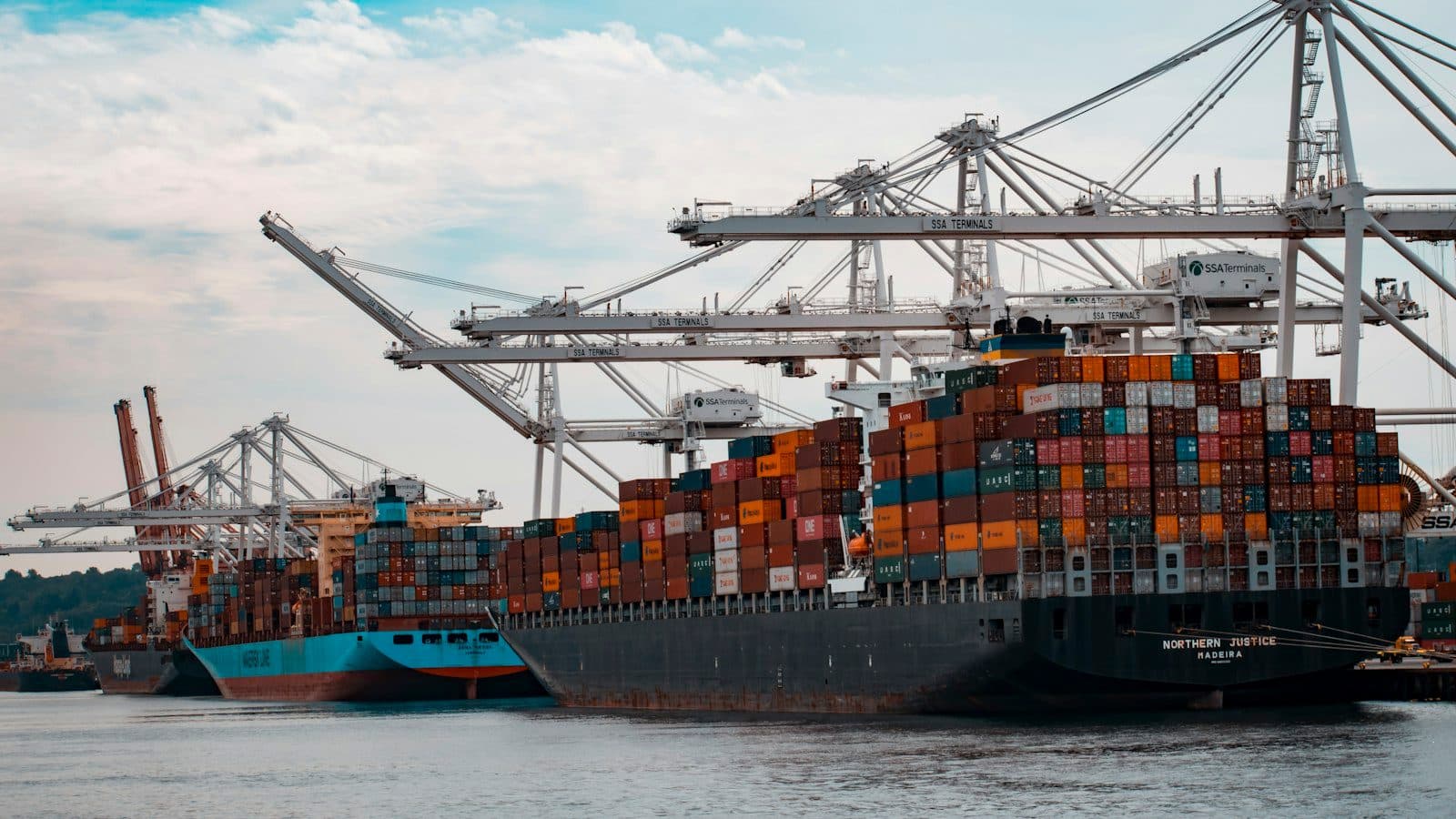 Shipping containers at a port representing US inbound trade and fulfillment